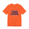 Front view of the orange Tiger Stadium. Forever. tee with crossed-out Improper Fraction typography.